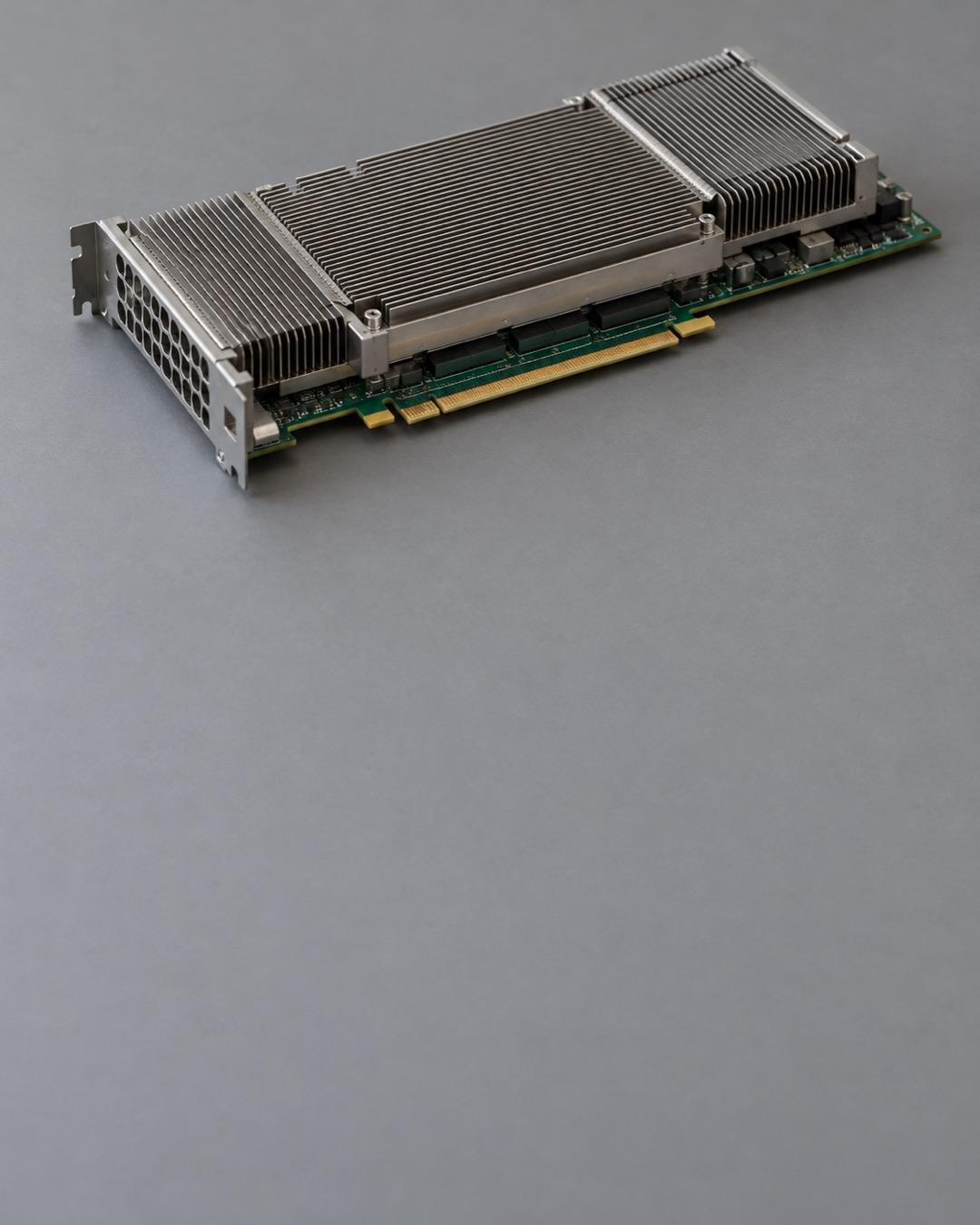 Server graphics processing module with metal heatsink fins on a grey workbench